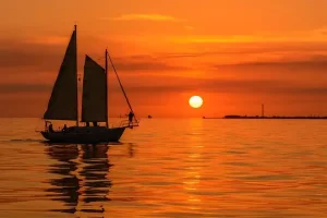 Florida golden sunset with sailboat