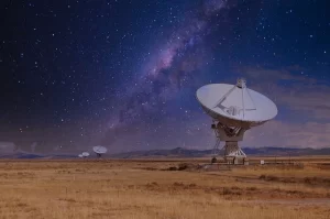 Satellite dish against starry sky
